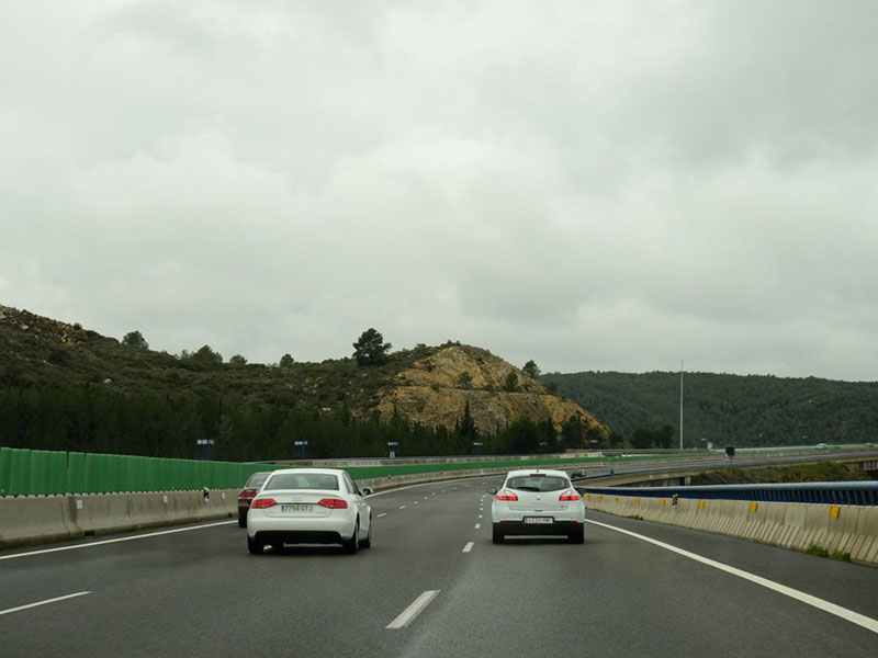 Outside built-up areas, how do you warn the driver ahead of your intention to overtake?