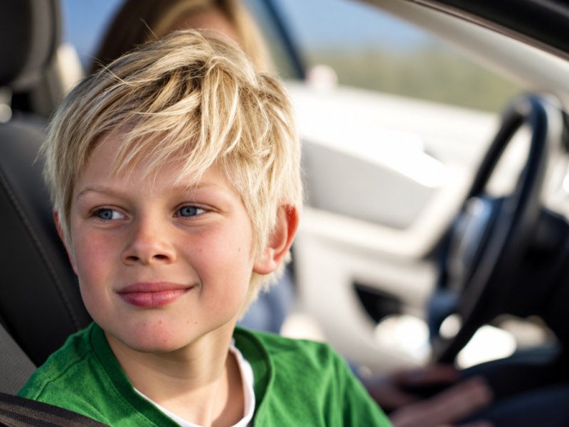 Can a child under 12 years old and shorter than 135 cm travel in the front seat of a private car without a child…