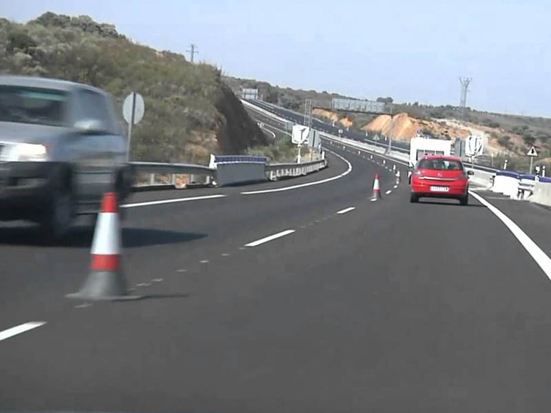 Are motorcycles allowed to travel in a lane opened to traffic in the opposite direction to normal?